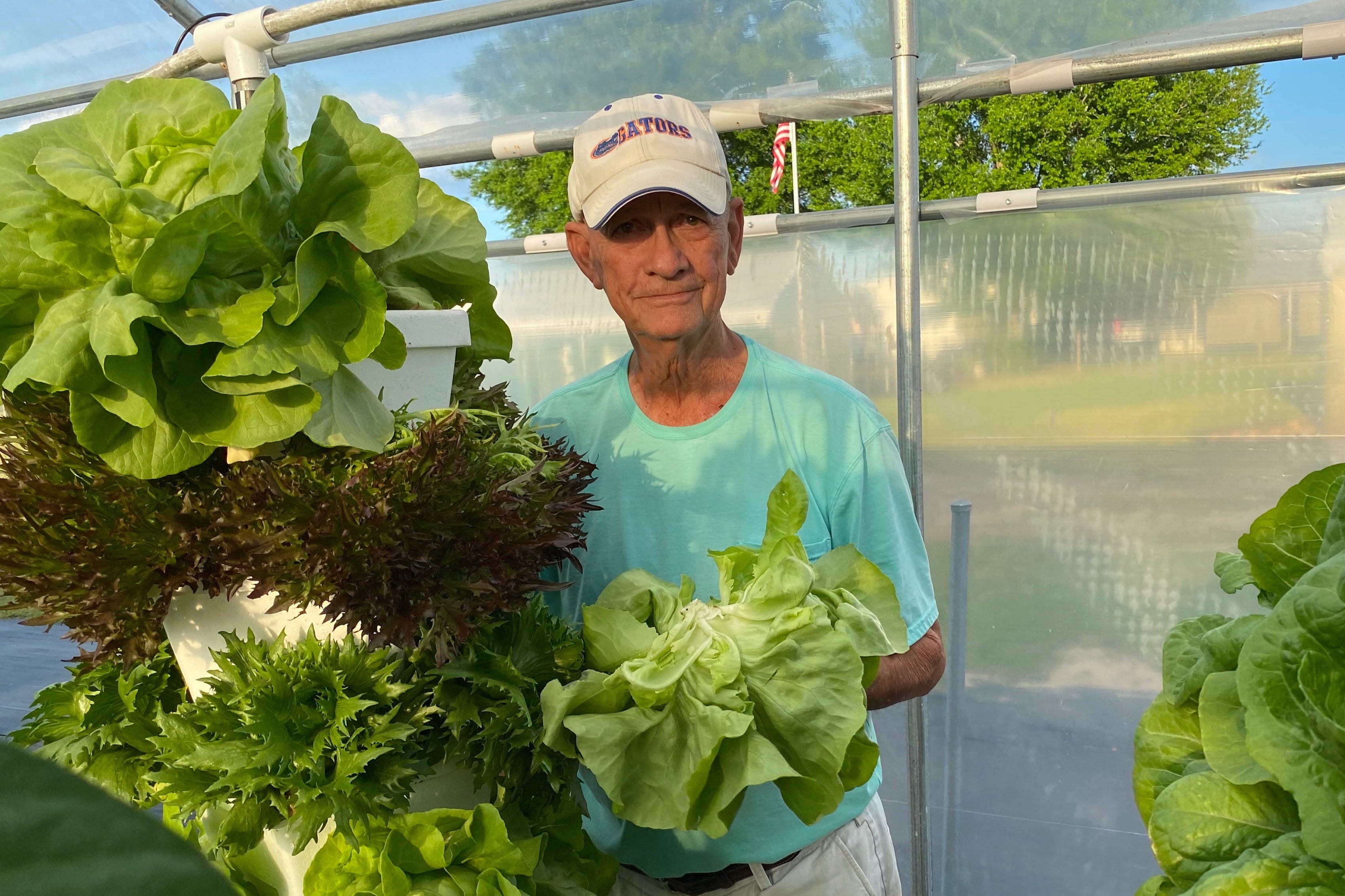 Tim standing next to lettuce tower